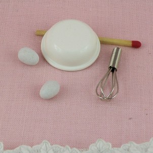 Metal Egg whisk , eggs and bowl