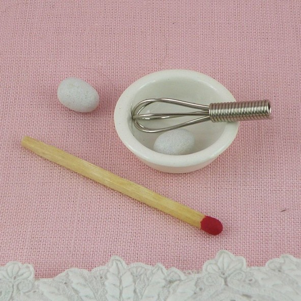 Miniature metal Egg whisk , eggs and bowl