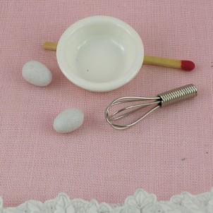 Metal Egg whisk , eggs and bowl