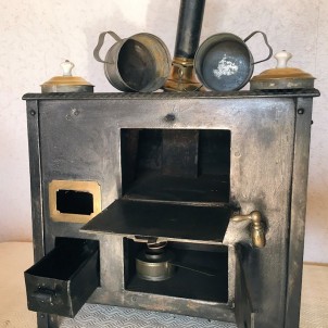 Wood-burning stove dollhouse kitchen.