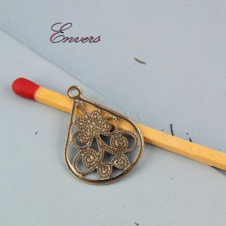 Charm pendentive forms drop out of openwork metal 2 cm
