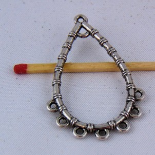 Charm pendentive forms drop out of openwork metal 4 cm