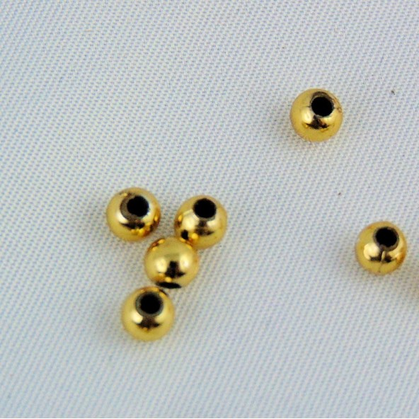 10 Perles ronde dorées 3 mm.