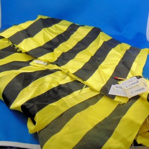 Synthetic coupon with large yellow and black stripes