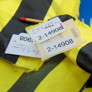 Synthetic coupon with large yellow and black stripes