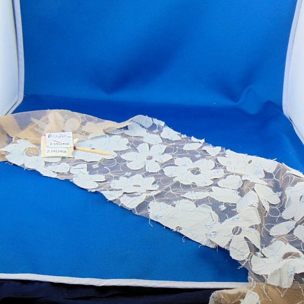 Gauze strip with sewn fabric flowers
