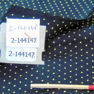 Cotton fabric with yellow and black polka dots by 50 centimetres in 140 cm